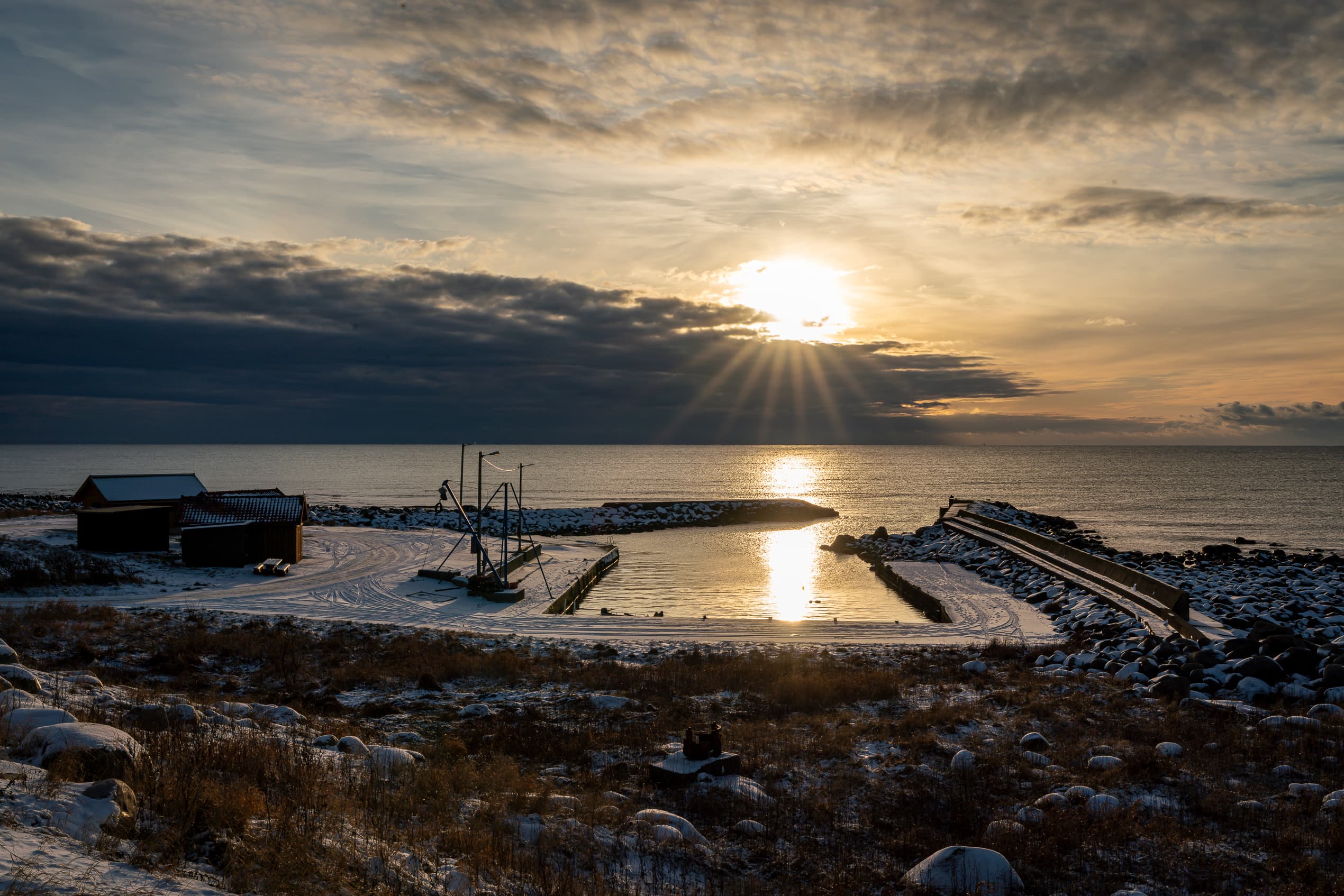 madland harbour in sunset and in winter with snow
