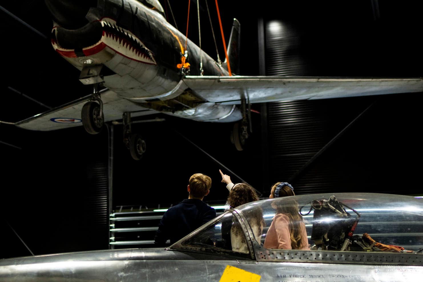 people looking at aircraft exhibition at the aviation museum